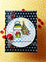 Polka-dot card with the snowman and tree in a circle and 'missing you this holiday season.'