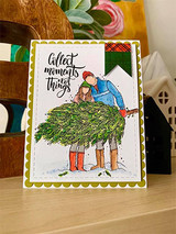 Card of the couple hauling the Christmas tree, 'Collect moments not things'