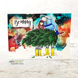 Bright card with the couple and tree over an alcohol-ink background, 'Be merry'