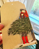 Kraft tag with the couple and Christmas tree colored in