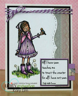 Card with the girl colored in purple with purple boots on a blue panel with a lace edge, beside the Emerson sentiment and purple twine.