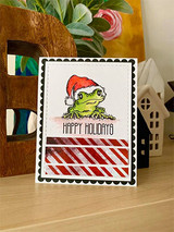 Santa-hat frog colored green on a white postage-frame card with 'Happy Holidays.'