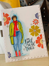 The woman in a green jacket on a white card with scattered flowers, captioned 'The best is yet to come.'