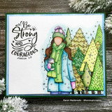 Angie Blom's AngieGirl bundled in a scarf and hat holding a hot drink with 'Happiness, pure and simple,' a red rubber winter stamp on a card.