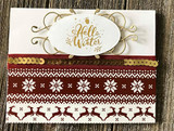 Cream card with a gold sequin strip and a fair isle style border in deep red, topped with a gold embossed oval stamped 'Hello Winter'.