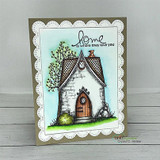 Handmade card with Angie Blom's charming storybook cottage with a peaked roof and arched door, sentiment 'home is not a place it's a feeling'.