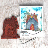 Handmade card with Angie Blom's charming storybook cottage with a peaked roof and arched door, sentiment 'home is not a place it's a feeling'.