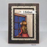Card with the girl at a night window on wood-grain, 'I Believe.'