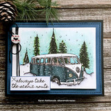 Handmade card featuring the vintage camper van among snowy pine trees, framed in black with a lamppost, stamped with 'Good friends, great adventures'.