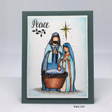 Peace card of the nativity colored in blues with a gold star on a slate frame.