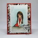 Red card with a dark floral border and a stitched panel, the girl colored in a red dress against a soft blue wash, with you are special to me in script at the right.