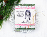 White card with pink and green Christmas paper strips on a doily, the girl stamped in outline and a typed sentiment about being awesome above her.