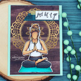 Card of the meditating girl colored in teal and blue over a gold mandala, 'just let it go.'