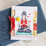 Card of the red-vested yoga girl on a blue mat over floral papers, 'just breathe.'