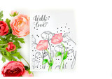 A white card with two sketched roses colored in soft pink and green, scattered black dots, and the sentiment 'With love' at the top, styled with fresh roses.