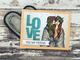 Kraft card of two friends in a blanket colored beside teal LOVE, 'you my friend'