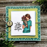 Card of the girl in a teal outfit with a rose bouquet and 'Today is all about you' on green patterned layers.