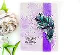 Lavender card with a purple glitter strip and white peonies alongside, a teal and black feather cluster die cut and layered, with "The good things are better with you" stamped below.