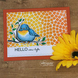 Orange card with a gold mosaic-stenciled panel: the bird colored blue and yellow on its branch above “HELLO new life.”