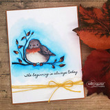White card with a soft blue watercolor halo: the bird colored gray and orange on the branch over “The beginning is always today,” tied with yellow twine.