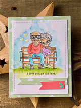 Card with the colored old couple on a bench over a green sky panel and 'I love you, ya old fart.'