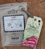 Packaged stamp set beside a tag card of a pink poppy, 'today is a most unusual day.'