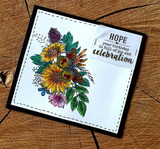 Card on a wood slice with the flower bouquet colored in sunflower gold, purple and green, and a tucked sentiment strip reading 'HOPE your birthday is full of joy and celebration.'
