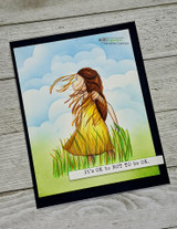 Card of the girl in a yellow dress on a soft blue sky background.