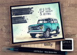 Card with a teal vintage Scout SUV and grunge tracks beside 'Life is either a great adventure or nothing.'