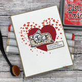 Card of the puppy inside a red confetti heart, "Happiness is a warm puppy."