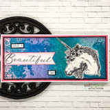 Slim card on a white brick wall, the unicorn stamped on a teal and pink inked panel, sentiment built to read 'HAVE A Beautiful DAY'.