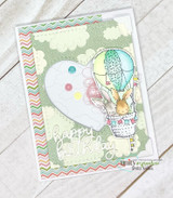 Soft green cloud-print card with a large white heart, the bunnies in a teal and green balloon, sentiment 'happy birthday' in white embossing.