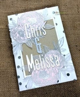 Burlap-backed keepsake with pale peonies and 'Chris & Melissa' lettering on vellum.