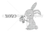 Red rubber bunny holding a little bouquet, with the sentiment 'XOXO'