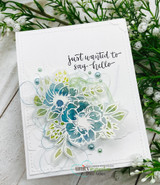 White card with layered teal and green flowers and 'just wanted to say hello.'