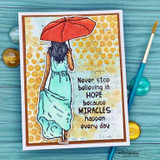 A card project showing a flowing handwritten script background, paired with the greeting "Never stop believing in hope."