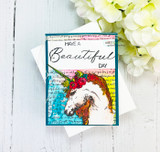 A flowing handwritten script background stamped in red rubber and colored on a handmade card reading "In your own time and way."