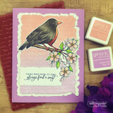 Embossed card of a dark bird on the branch with 'those who wish to sing always find a song.'