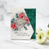 Handmade graduation card with a gray cap surrounded by coral magnolias and the sentiment 'Bittersweet endings, exciting beginnings' on teal script paper.