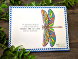 Rainbow dragonfly on a white card, 'for God has not given us a spirit of fear, but of power and of love'.