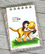 Striped card with the girl hugging a golden dog, 'Sending a big ol' hug your way.'