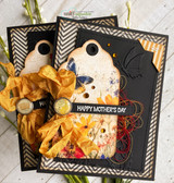Two black chevron framed cards with floral tags, gold crinkled ribbon and butterflies, each finished with the "Happy Mother's Day" strip.