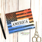Warm-toned card of a stamped flag with "AMERICA, land of the free."