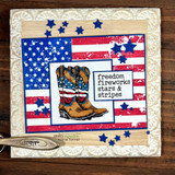 Card with the flag, work boots and blue stars, 'freedom fireworks stars & stripes.'