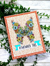 Butterfly colored bright over orange-framed script background — remember this banner