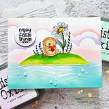 Handmade card with a stenciled cloud and sky background made using the stencil.