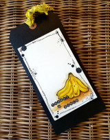 Black tag with a small bunch of bananas.