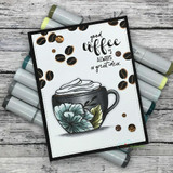Card of the floral coffee cup among scattered coffee beans, 'good coffee is always a great idea.'
