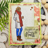 Handmade card featuring the autumn girl bundled in a coat and scarf holding a warm drink, on a bright green stitched frame, stamped with 'Every day is better because of you'.