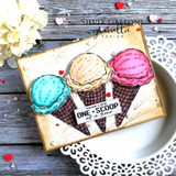 Card with three pastel scoops in a cone and 'ONE SCOOP at a time' on a plate backdrop.